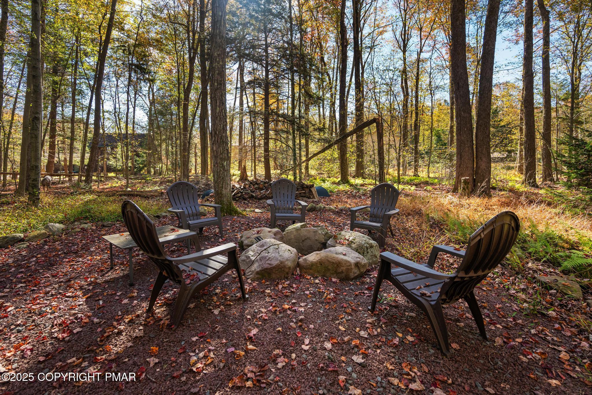 165 Sweet Briar Road Pocono Pines, PA 18350 - Photo 37 of 39 a backyard of a house with table and chairs