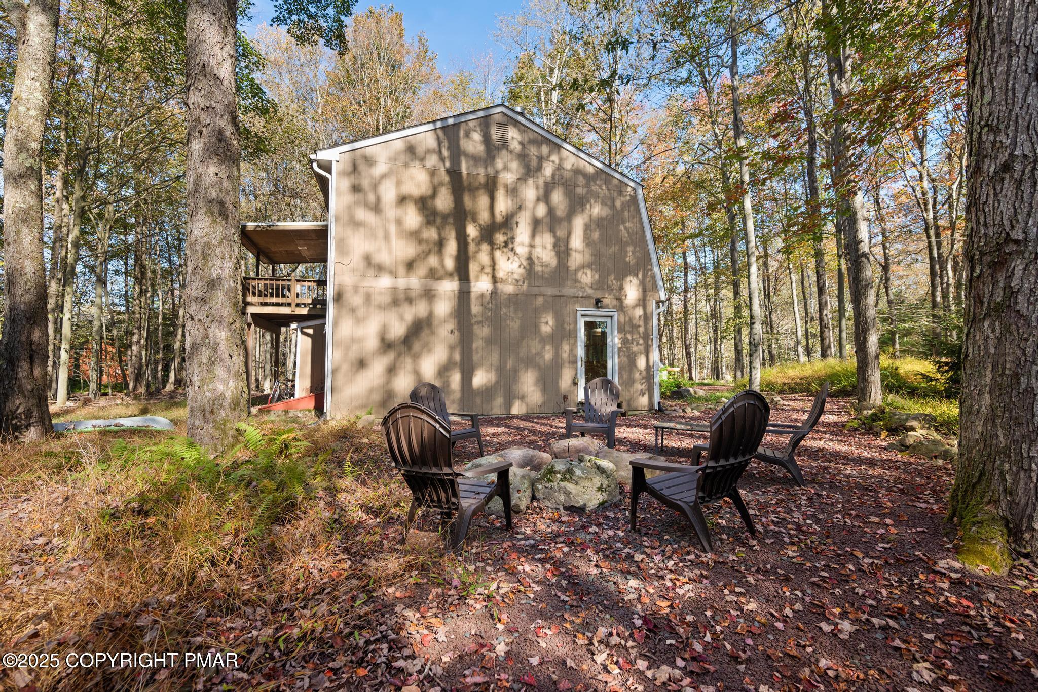 165 Sweet Briar Road Pocono Pines, PA 18350 - Photo 38 of 39 a backyard of a house with outdoor seating