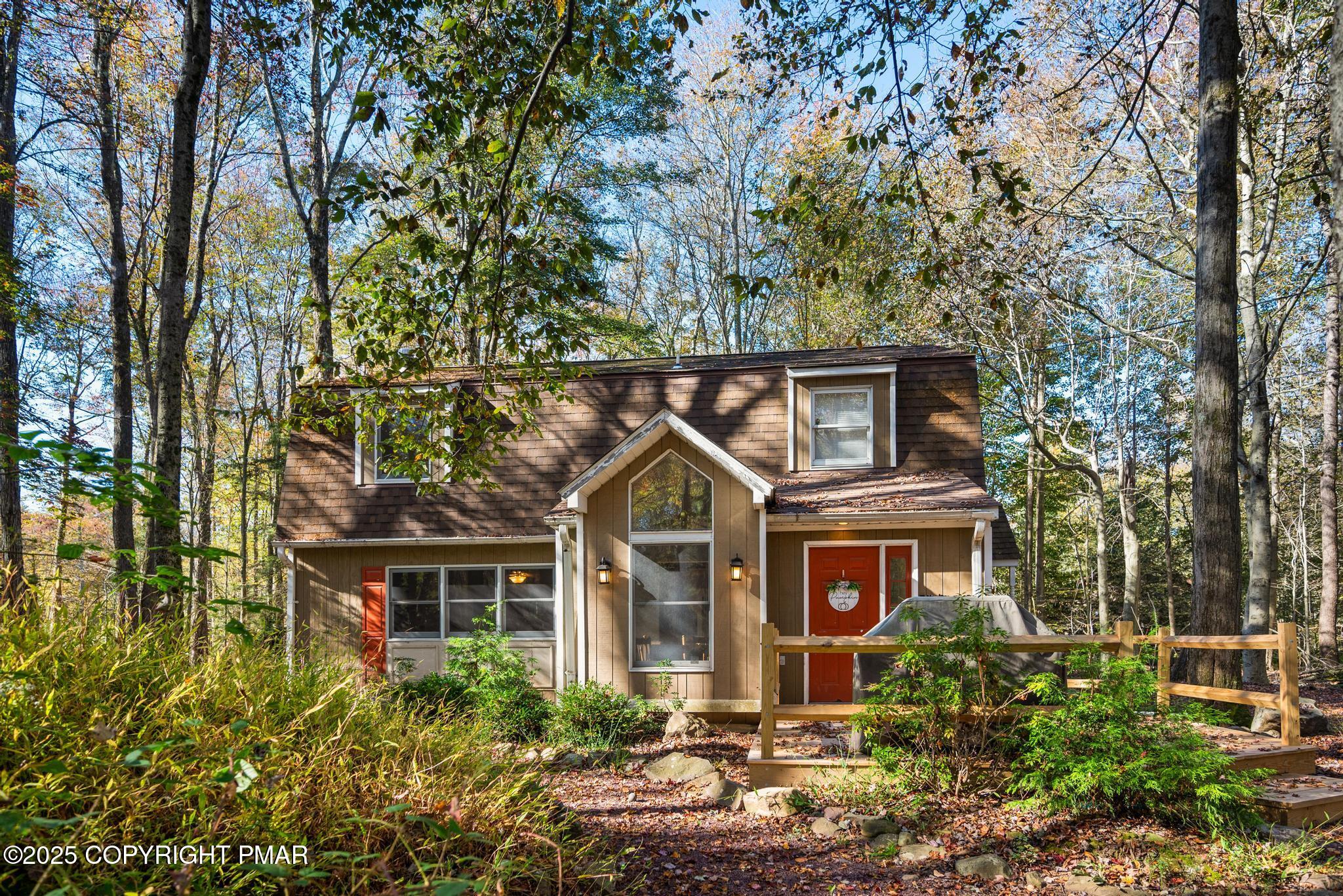 165 Sweet Briar Road Pocono Pines, PA 18350 - Photo 4 of 39 a front view of a house with garden