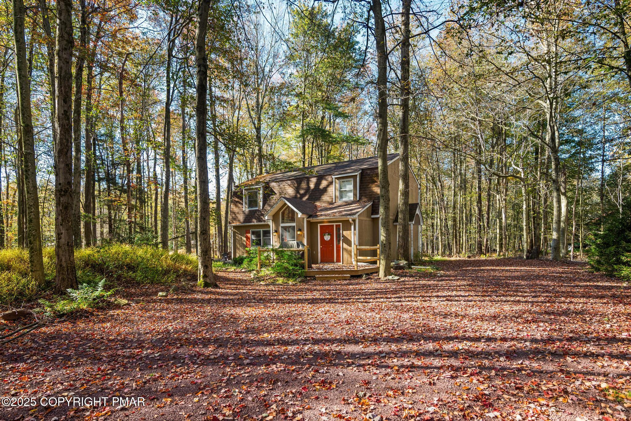 165 Sweet Briar Road Pocono Pines, PA 18350 - Photo 5 of 39 a front view of a house with garden