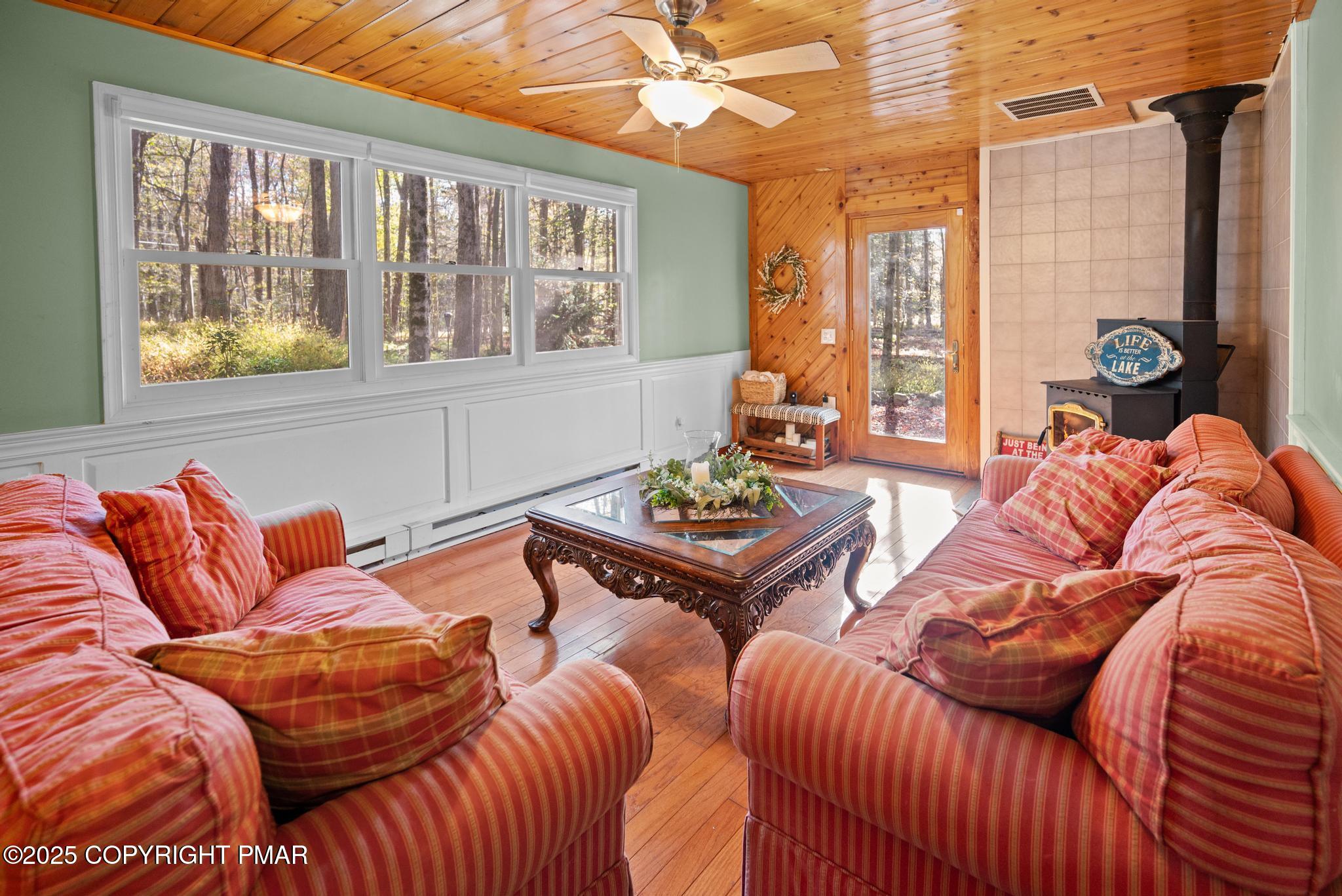165 Sweet Briar Road Pocono Pines, PA 18350 - Photo 10 of 39 a living room with furniture and a large window