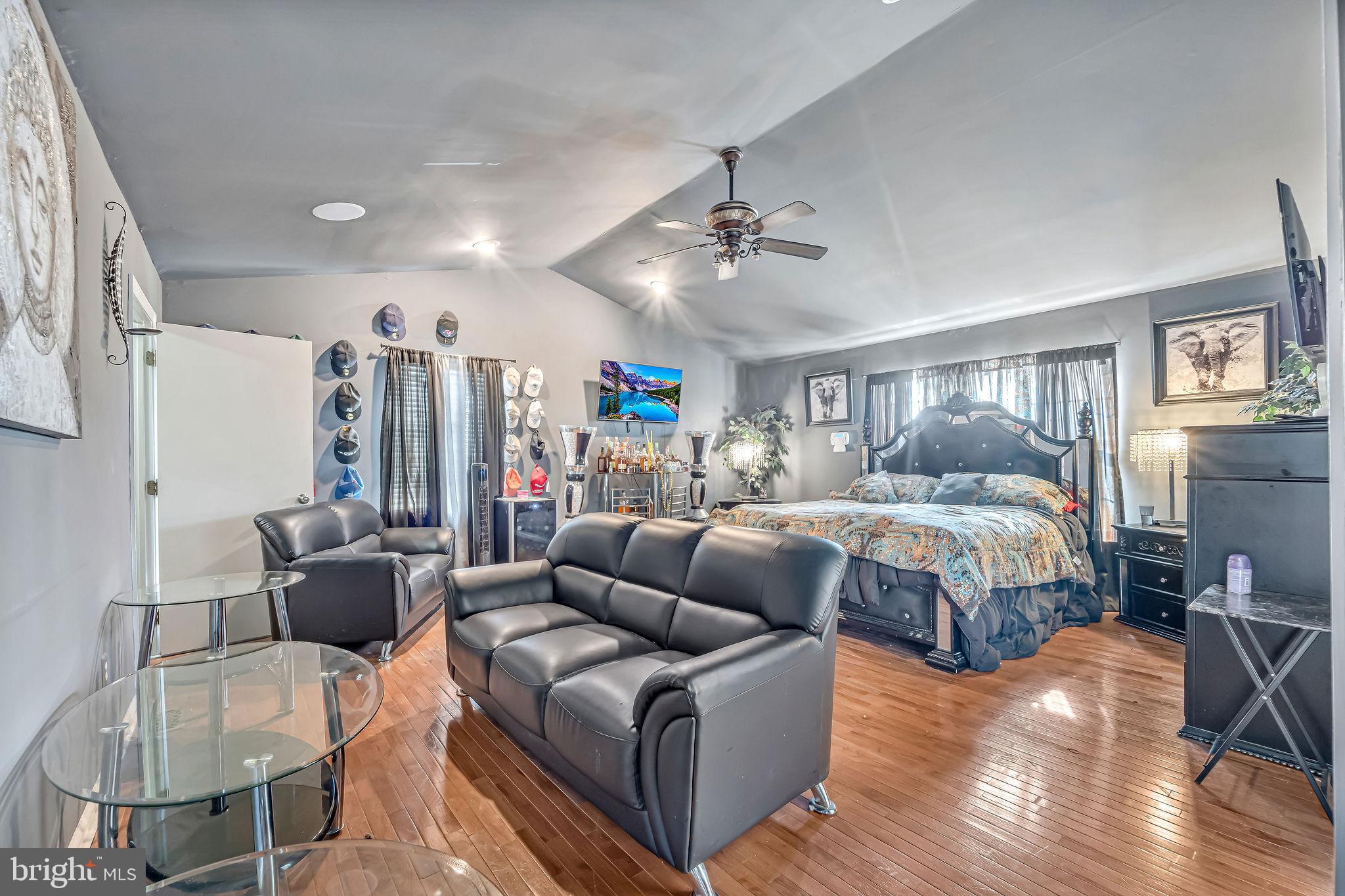 1 Granite Court Sicklerville, NJ 08081 - Photo 20 of 30 a bedroom with a bed a couch and potted plant view