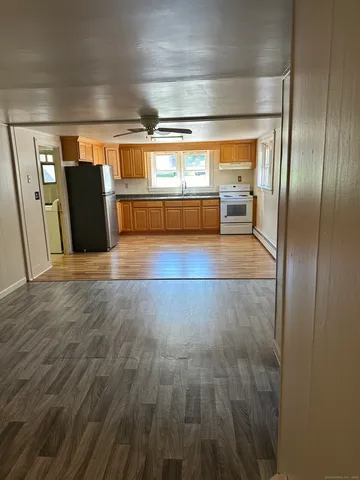 a view of entryway with wooden floor