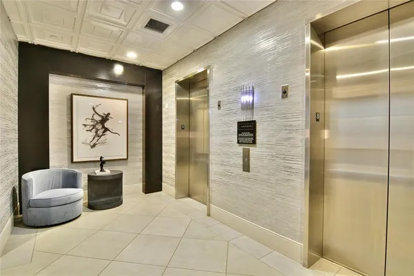 a lobby with furniture and shower