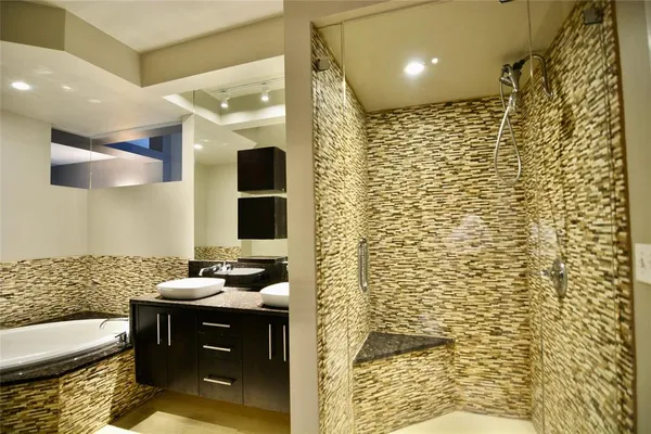 a bathroom with a sink toilet and shower