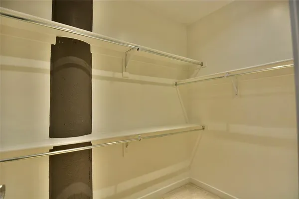 a view of an empty walk in closet