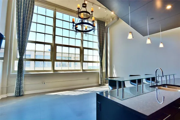 a kitchen with a sink a counter and a window