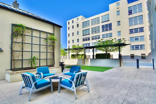 a view of a chairs and table in the patio