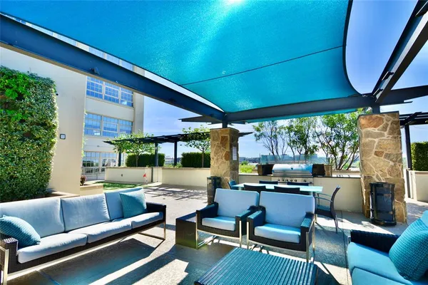 a outdoor living space with furniture and a fireplace