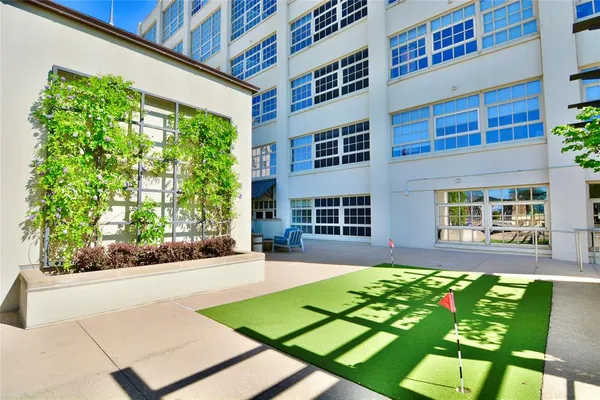 a view of yard in front of house with outdoor seating