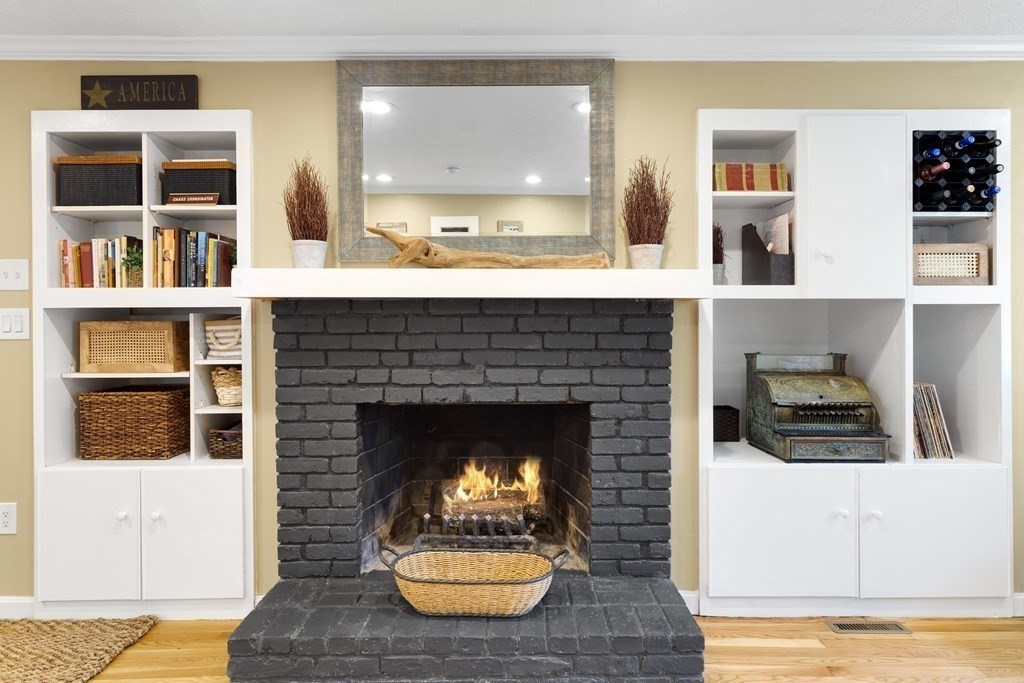 2 Cider Mill Road Framingham, MA 01701 - Photo 17 of 42 a living room with furniture and a fireplace