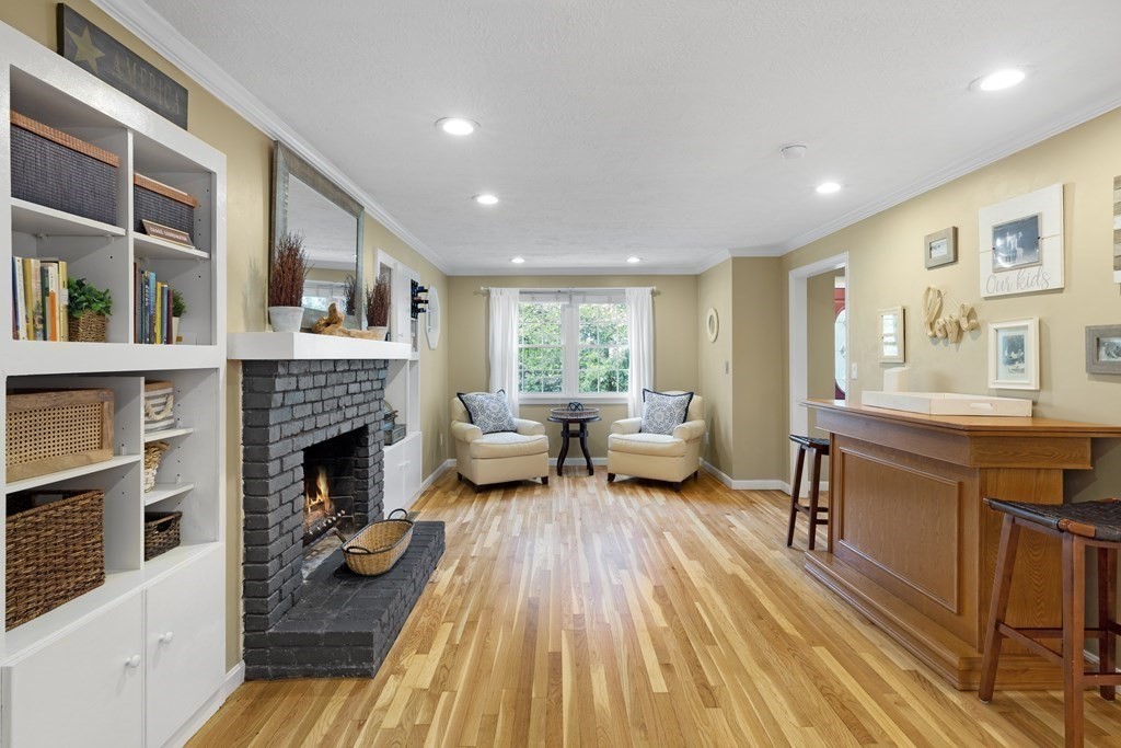 2 Cider Mill Road Framingham, MA 01701 - Photo 18 of 42 a living room with furniture and a fireplace