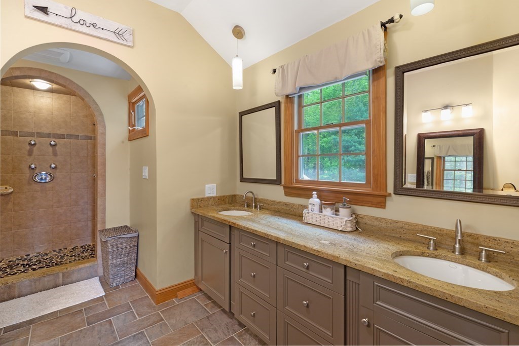 2 Cider Mill Road Framingham, MA 01701 - Photo 23 of 42 a bathroom with a granite countertop sink mirror and double