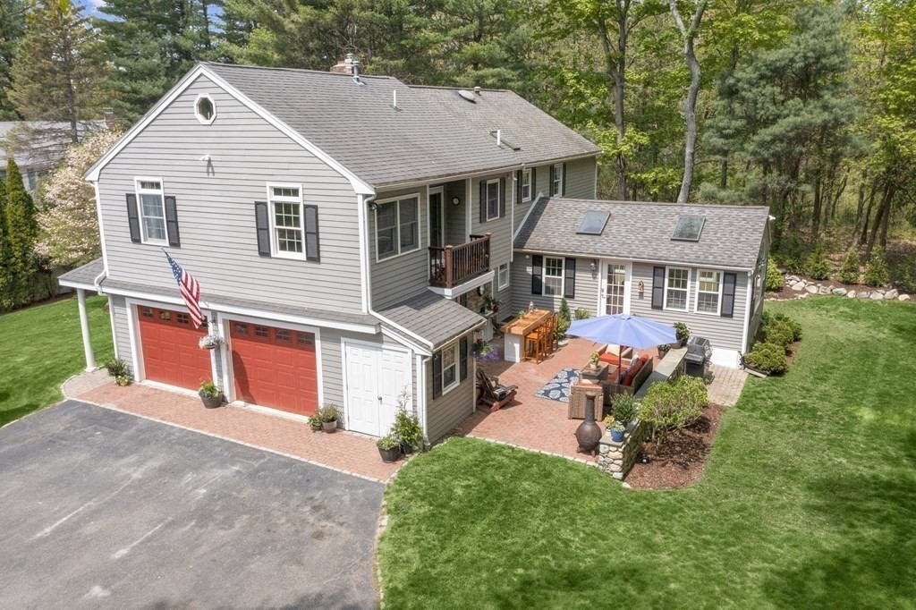 2 Cider Mill Road Framingham, MA 01701 - Photo 37 of 42 a front view of a house with a yard and garage