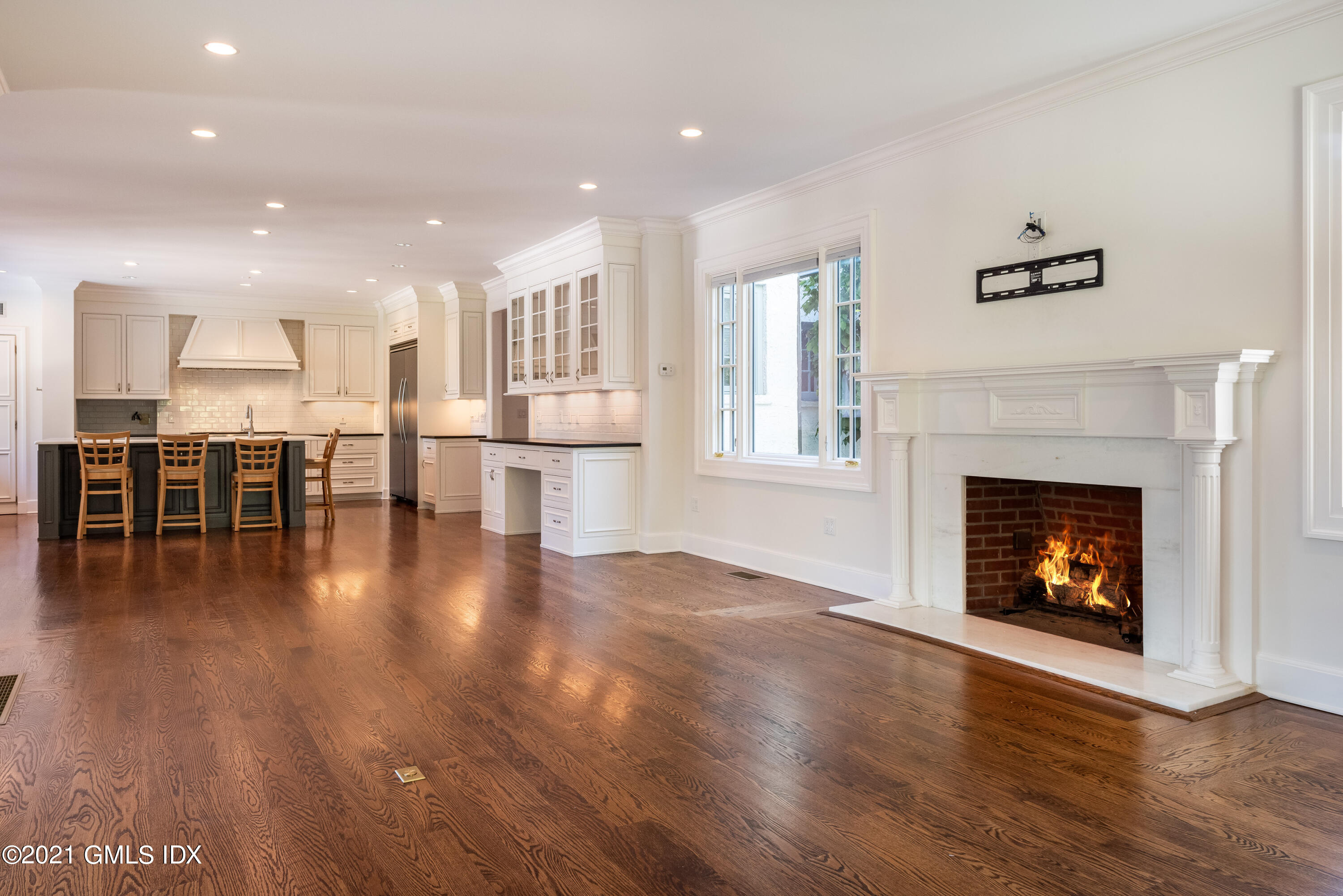 25 Doubling Road Greenwich, CT 06830 - Photo 11 of 30 a view of a livingroom with furniture a fireplace and wooden floor