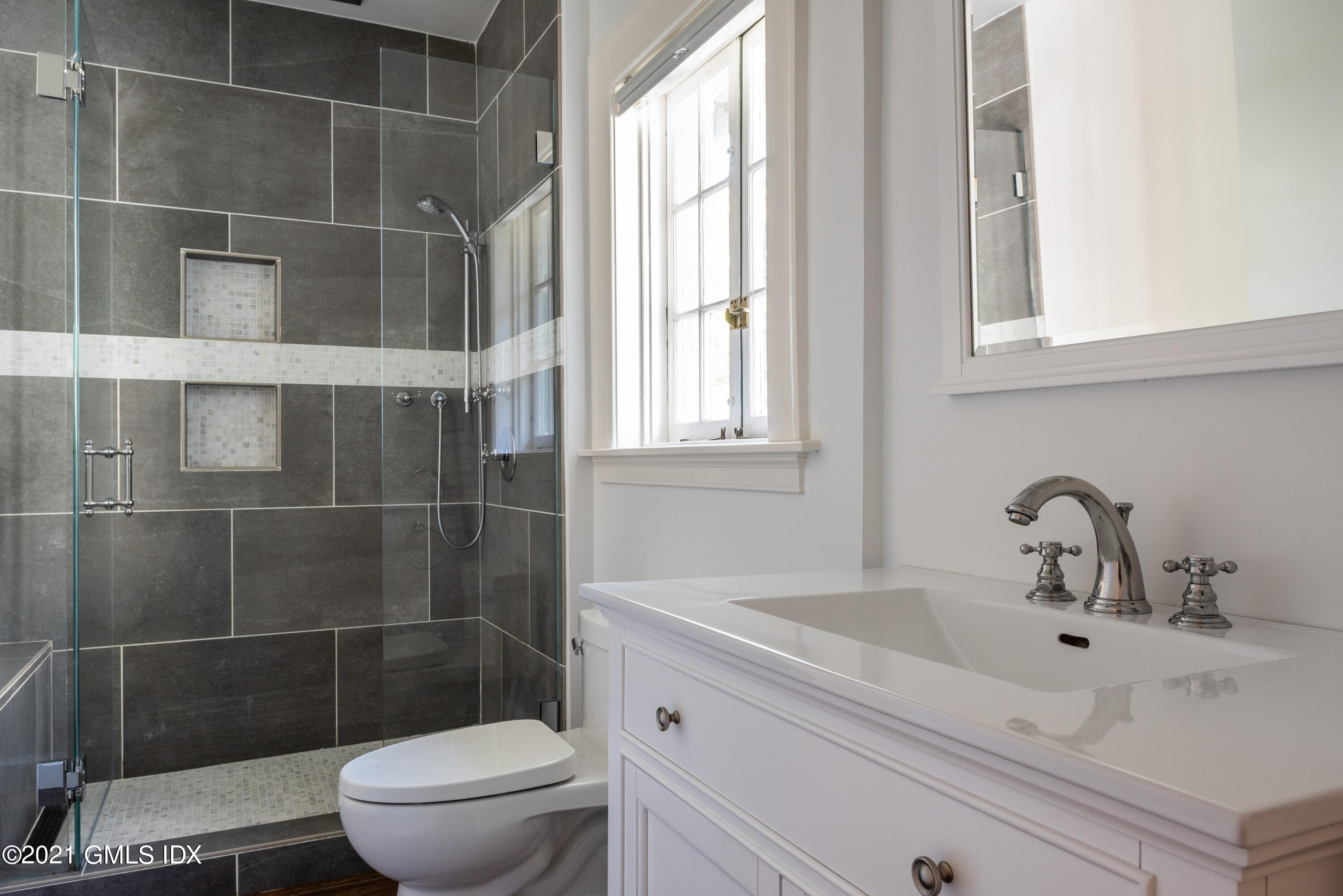 25 Doubling Road Greenwich, CT 06830 - Photo 17 of 30 a bathroom with a sink toilet and shower