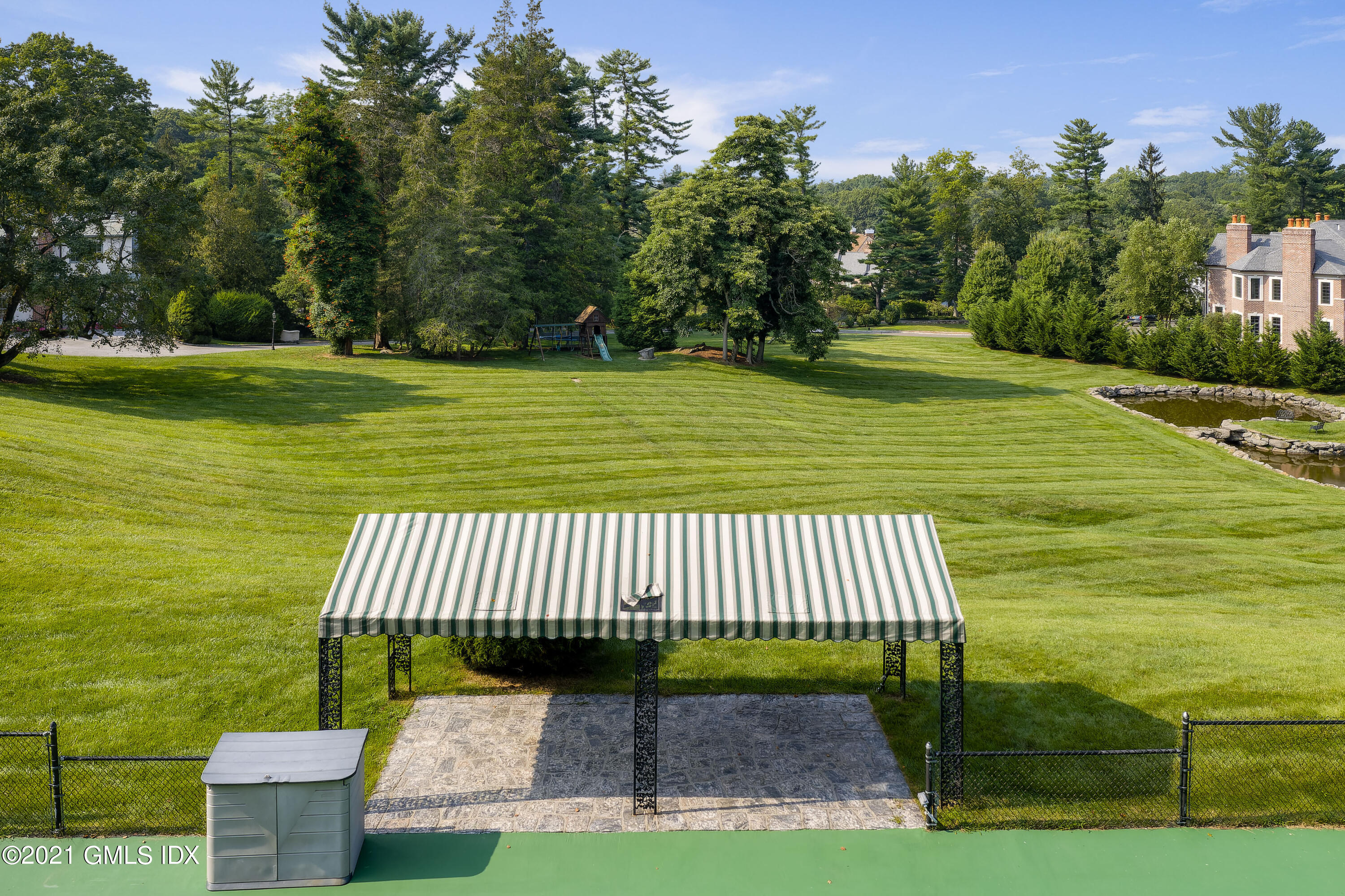 25 Doubling Road Greenwich, CT 06830 - Photo 21 of 30 a view of a patio with a garden