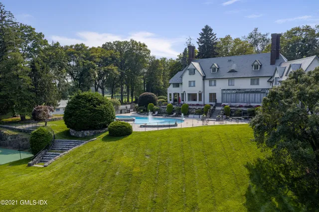 a view of a swimming pool with a garden