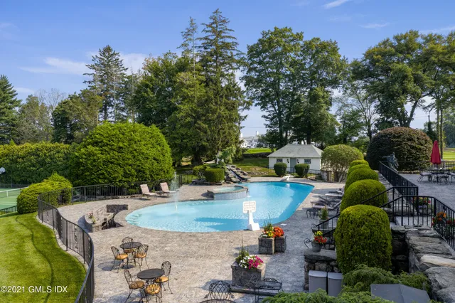 an aerial view of a house with outdoor space