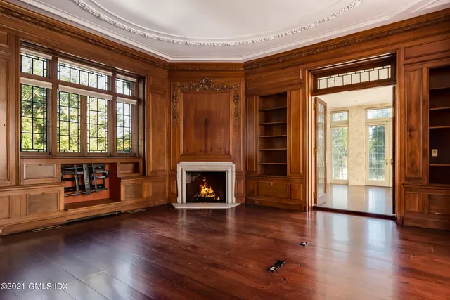 a kitchen with stainless steel appliances granite countertop a stove top oven a sink with island and chairs in it