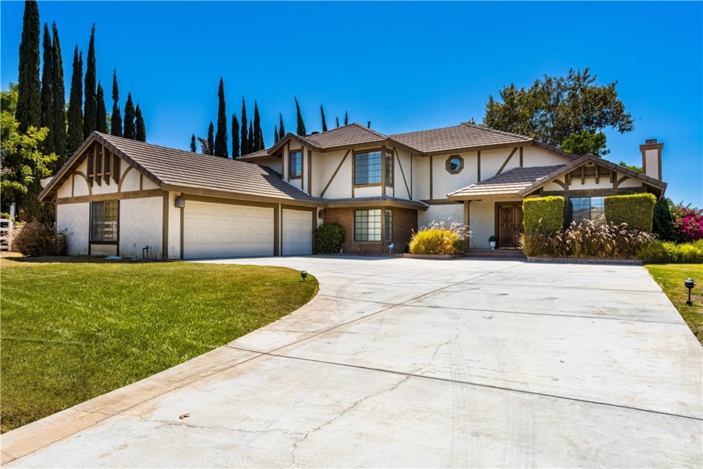 8079 Golden Star Avenue Riverside, CA 92506 - Photo 1 of 1 a front view of a house with a yard