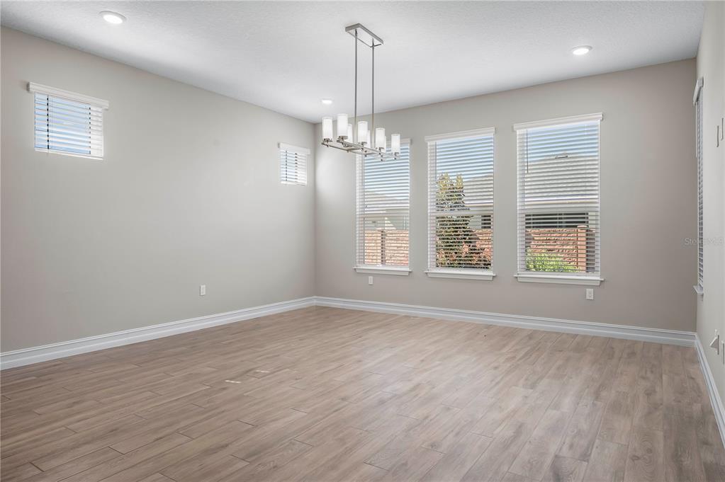 4474 Northwest 53rd Avenue Road Ocala, FL 34480 - Photo 19 of 78 wooden floor in an empty room with a window