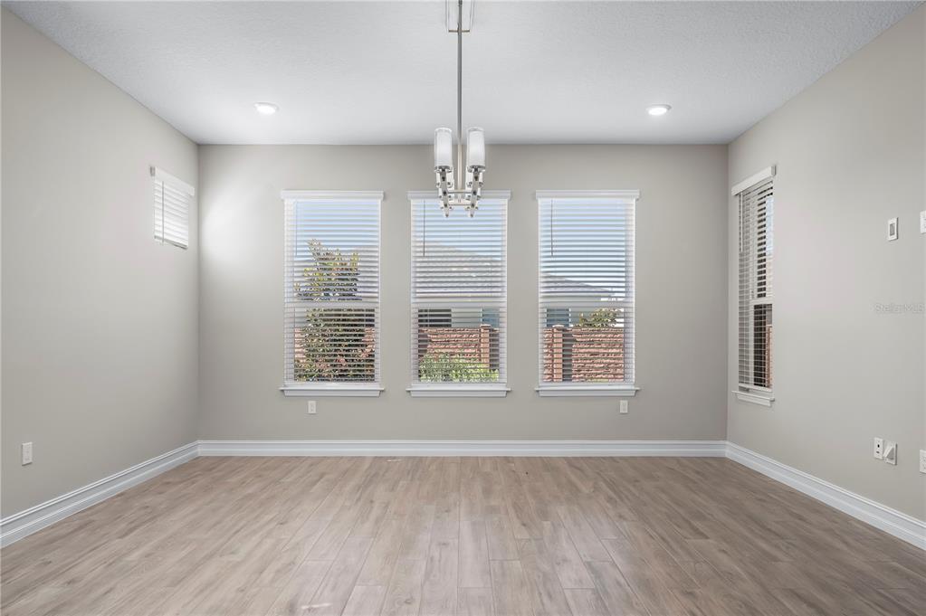 4474 Northwest 53rd Avenue Road Ocala, FL 34480 - Photo 21 of 78 a view of an empty room with wooden floor and a window