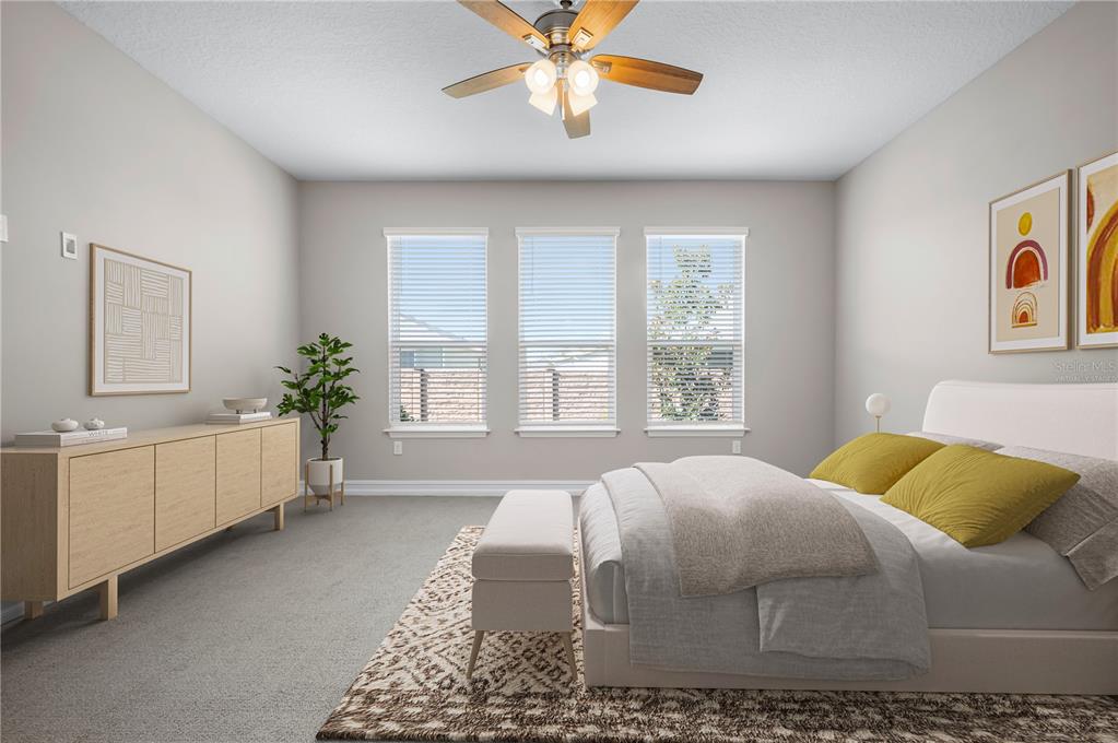 4474 Northwest 53rd Avenue Road Ocala, FL 34480 - Photo 25 of 78 a bedroom with a bed and a chandelier