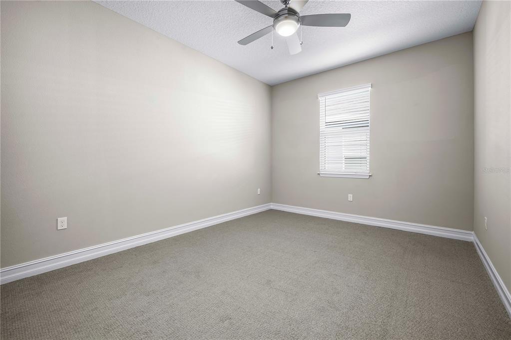4474 Northwest 53rd Avenue Road Ocala, FL 34480 - Photo 30 of 78 an empty room with a window and a fan