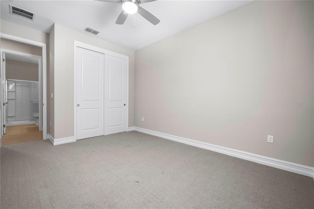 4474 Northwest 53rd Avenue Road Ocala, FL 34480 - Photo 32 of 78 an empty room with a empty space and a ceiling fan