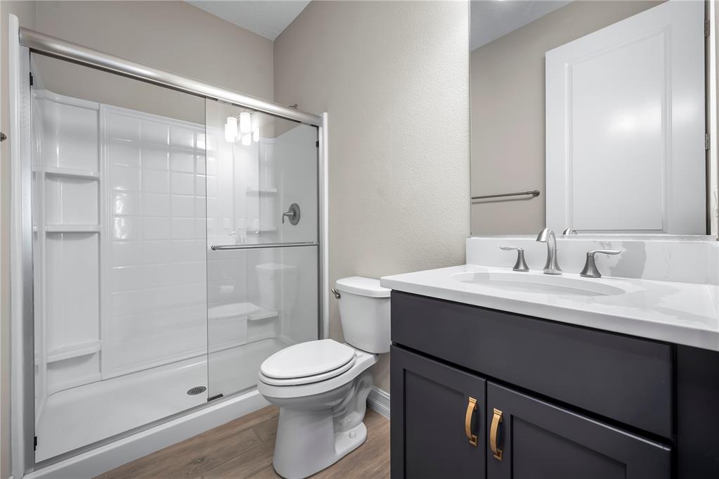 4474 Northwest 53rd Avenue Road Ocala, FL 34480 - Photo 33 of 78 a bathroom with a sink toilet and shower