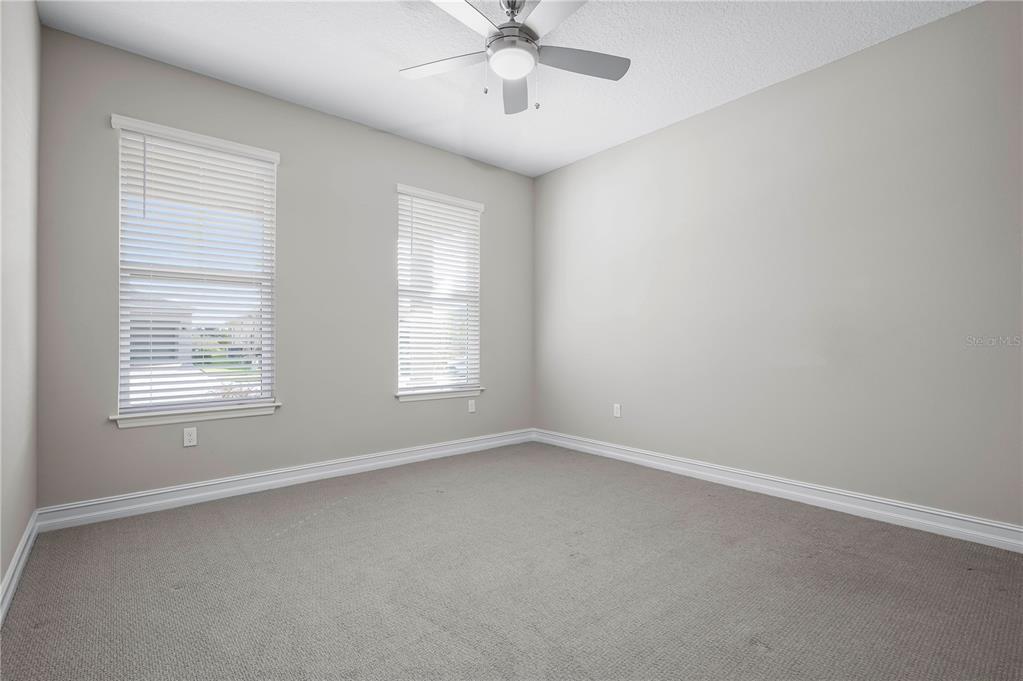 4474 Northwest 53rd Avenue Road Ocala, FL 34480 - Photo 35 of 78 an empty room with a window and a fan