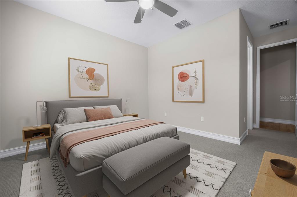 4474 Northwest 53rd Avenue Road Ocala, FL 34480 - Photo 36 of 78 a bedroom with a bed and a painting on the wall