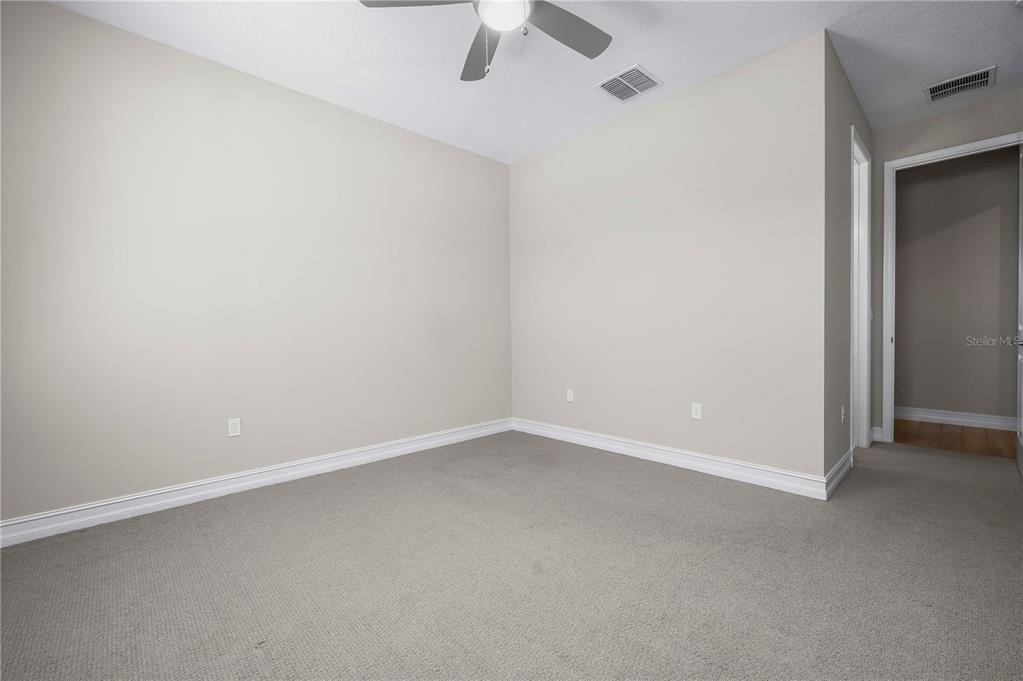 4474 Northwest 53rd Avenue Road Ocala, FL 34480 - Photo 37 of 78 an empty room with a ceiling fan and a window