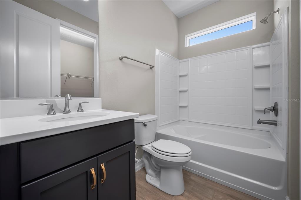 4474 Northwest 53rd Avenue Road Ocala, FL 34480 - Photo 38 of 78 a bathroom with a sink toilet tub and shower