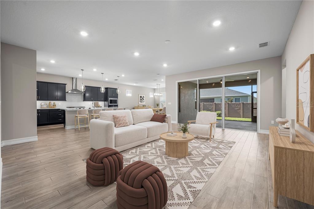 4474 Northwest 53rd Avenue Road Ocala, FL 34480 - Photo 4 of 78 a living room with fireplace furniture and a wooden floor