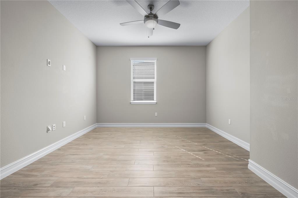 4474 Northwest 53rd Avenue Road Ocala, FL 34480 - Photo 41 of 78 wooden floor in an empty room with a window