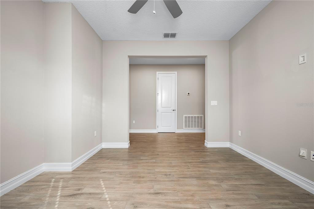 4474 Northwest 53rd Avenue Road Ocala, FL 34480 - Photo 43 of 78 a view of an empty room and wooden floor