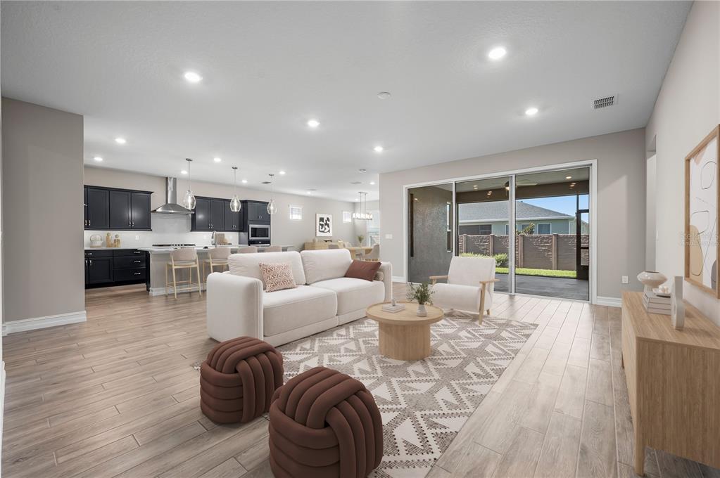 4474 Northwest 53rd Avenue Road Ocala, FL 34480 - Photo 6 of 78 a living room with fireplace furniture and a wooden floor