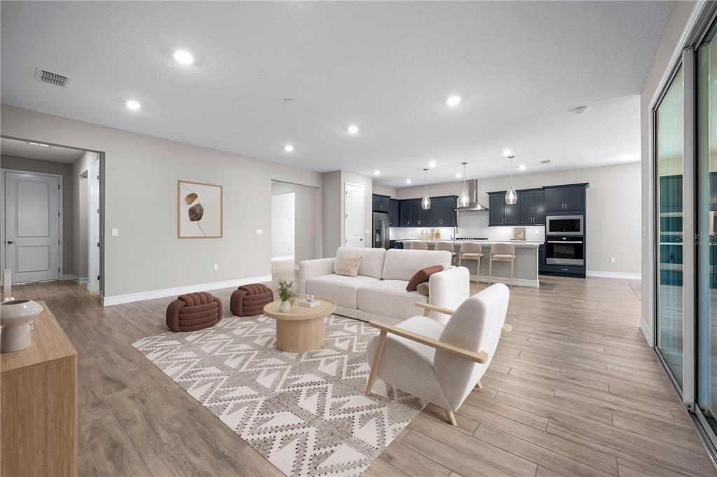 4474 Northwest 53rd Avenue Road Ocala, FL 34480 - Photo 8 of 78 a living room with furniture and a wooden floor
