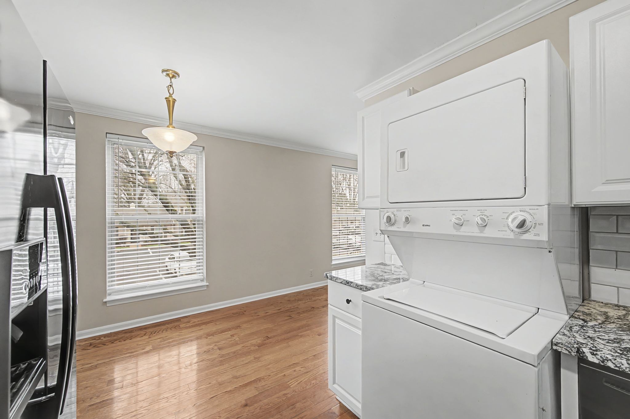 1011 Murfreesboro Road, Unit L10 Franklin, TN 37064 - Photo 22 of 47 a view of washer and dryer with wooden floor