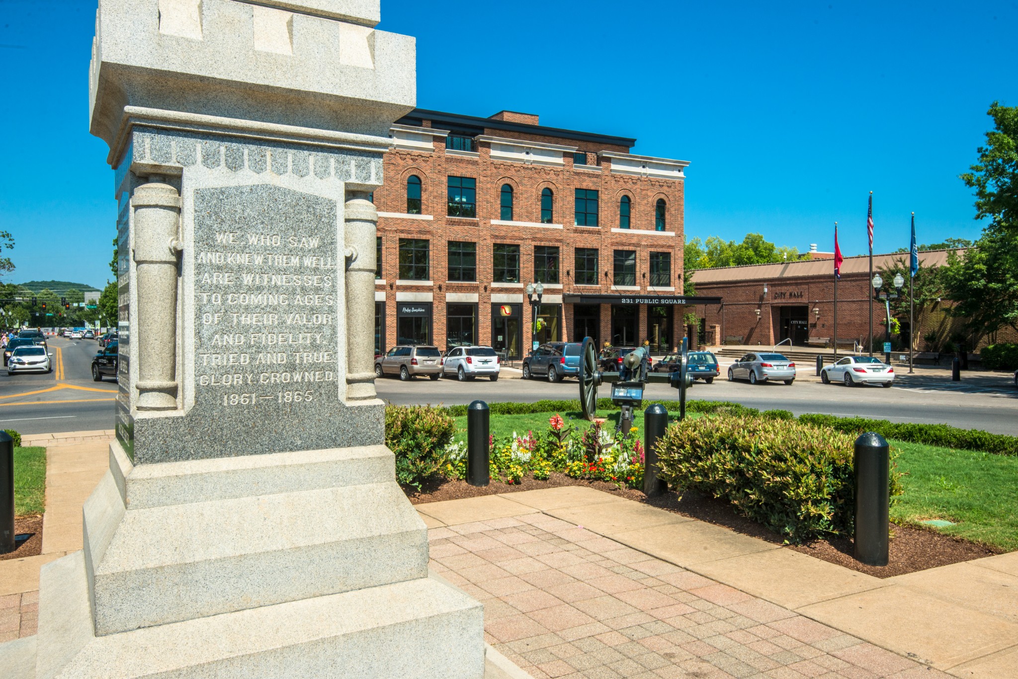 1011 Murfreesboro Road, Unit L10 Franklin, TN 37064 - Photo 46 of 47 a front view of a building with a garden and swimming pool