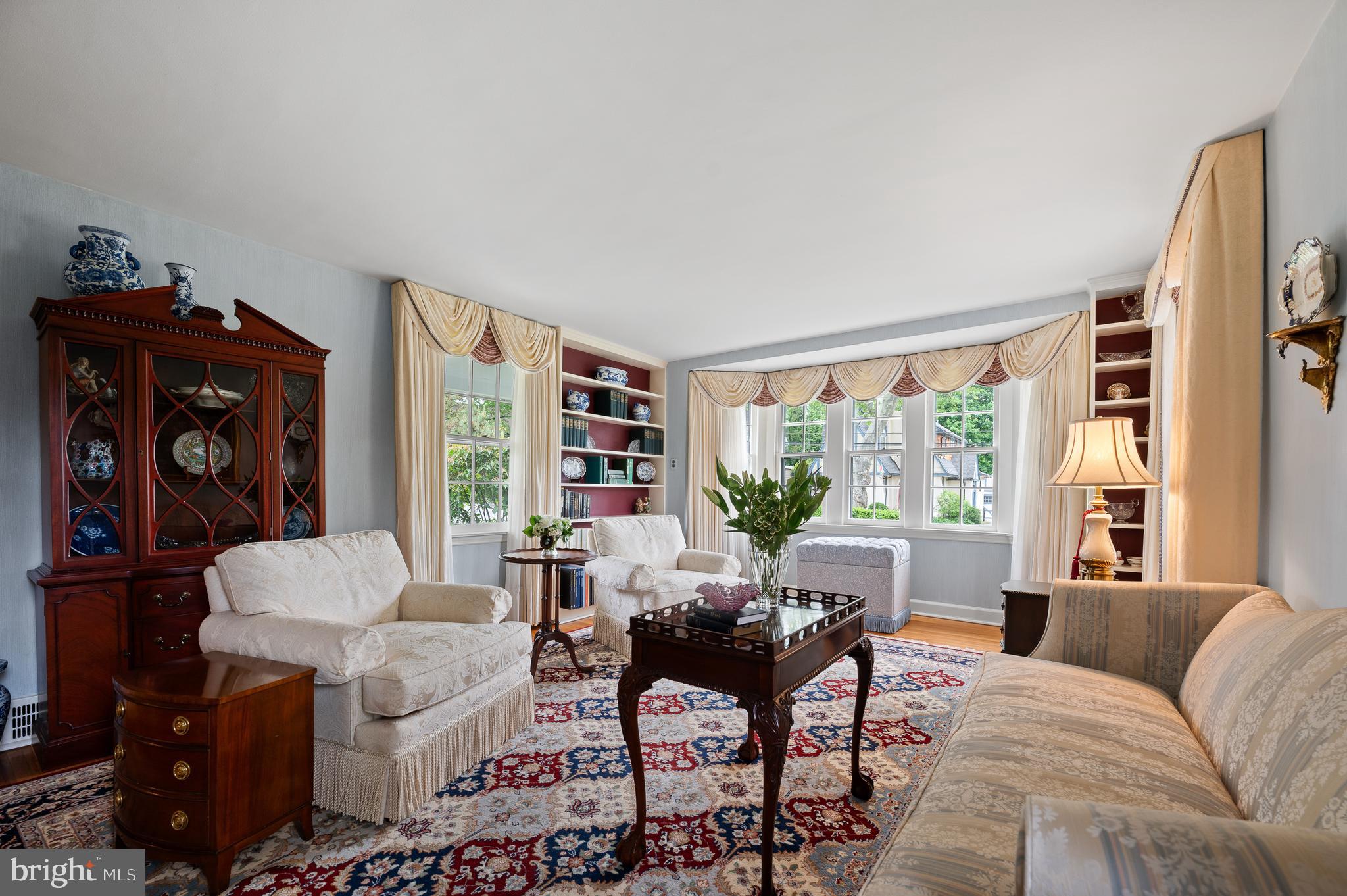 243 Walnut Road Strafford, PA 19087 - Photo 9 of 37 Living Room with Large Windows & Built-Ins