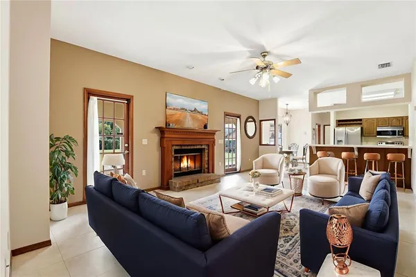 a view of an empty room with a fireplace