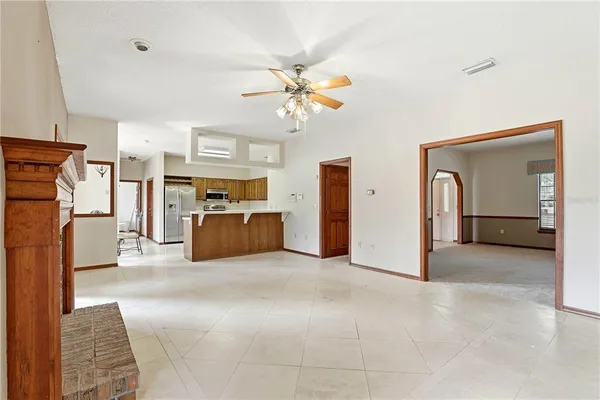 a kitchen with stainless steel appliances a stove a refrigerator and furniture