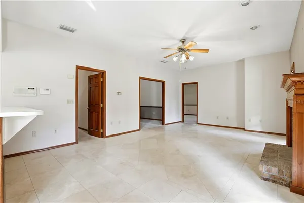 a kitchen with granite countertop a sink stove and refrigerator