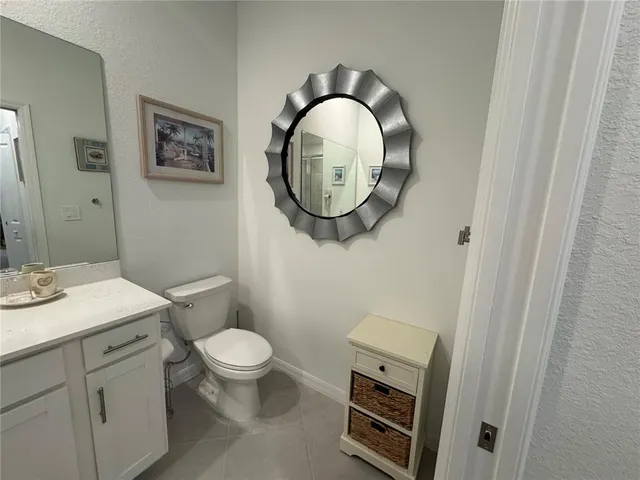a bathroom with sink shower and a mirror