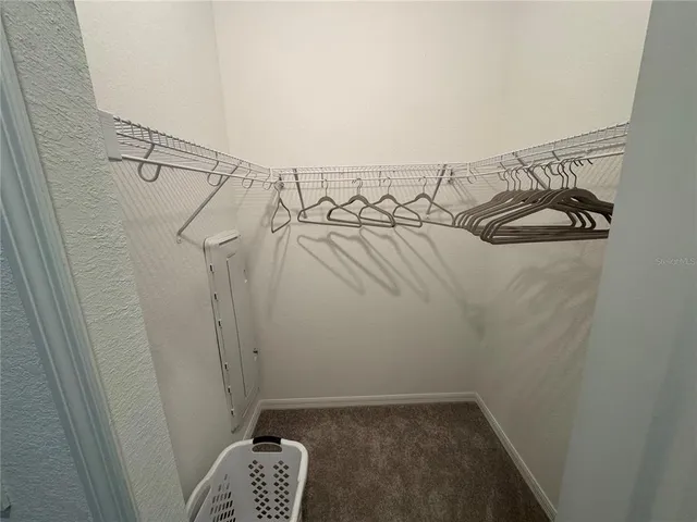 a bedroom with bed and window