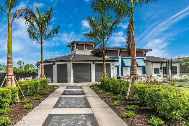 a view of a lake with a garden and seating space