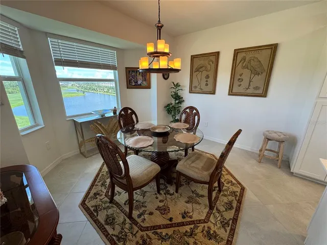 a dining room with furniture and window